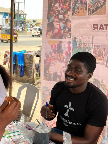 One of our volunteers at an outreach at Alimosho.